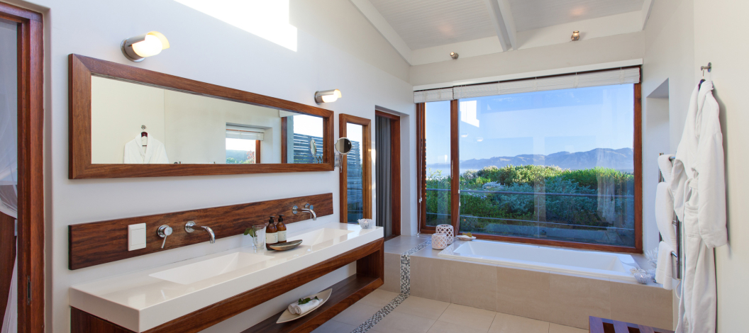 Take advantage of the 'bath-with-a-view' and the his & her basins.