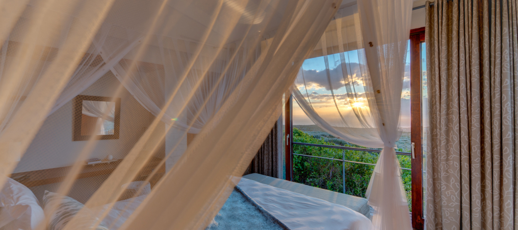 Soak in the scenery from the four-poster bed and appreciate space with a walk-in closet.